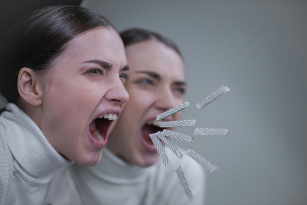 Brunette Woman Screaming Next to Mirror