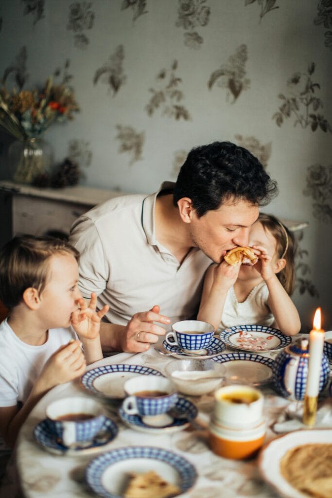 Father and Children Having Tea Together