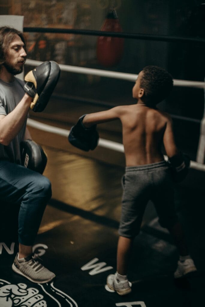 2 Men in Black Pants and Black Boxing Gloves